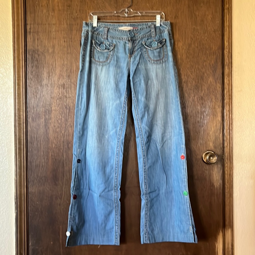 These have a retro look,they have wider legs and a button slit flare at bottom.